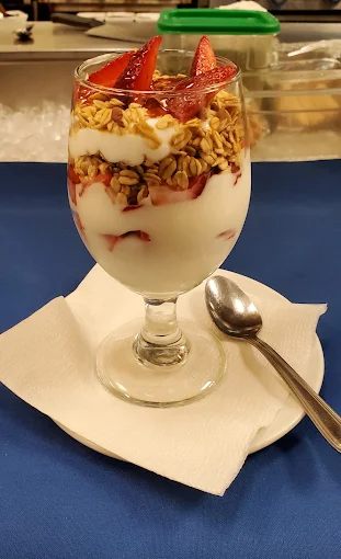 Fruit parfait layered with strawberries, yogurt and granola